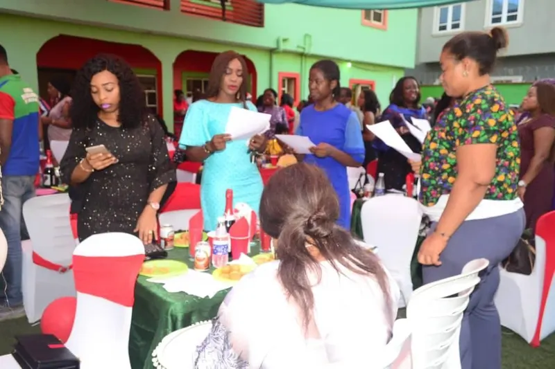 Parents and guests seated at tables during a school celebration